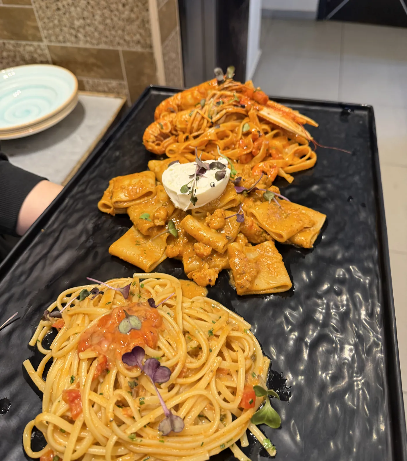 Three pastas served on one board