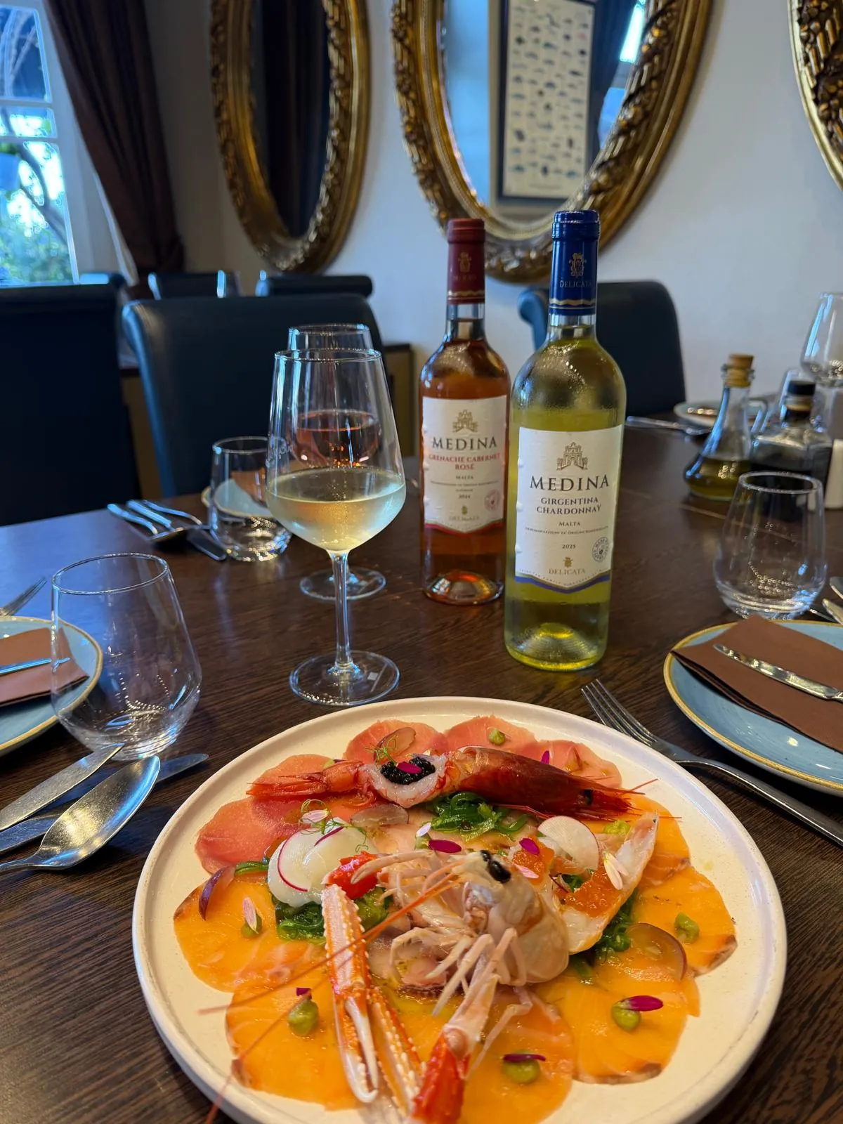Crudo with a glass of white wine